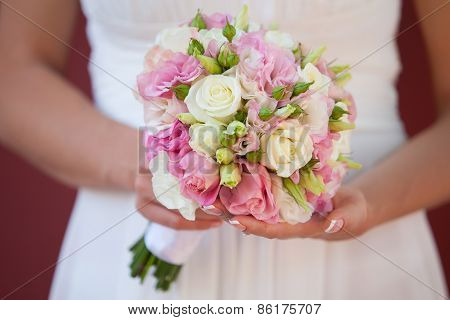 Wedding Bouquet Of Roses In The Hands Of The Bride