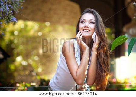 Close Up Of A Attractive Young Woman Speaking On Mobile Phone