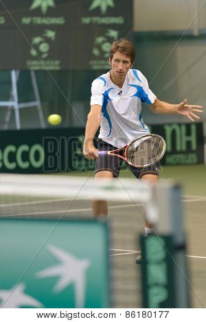 DNEPROPETROVSK, UKRAINE - APRIL 4, 2013: Sergey Stakhovsky, Ukraine on the training before Davis Cup match Ukraine vs Sweden. Ukraine won the match 3-2