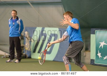 DNEPROPETROVSK, UKRAINE - APRIL 4, 2013: Illya Marchenko, Ukraine on the training before Davis Cup match Ukraine vs Sweden. Ukraine won the match 3-2