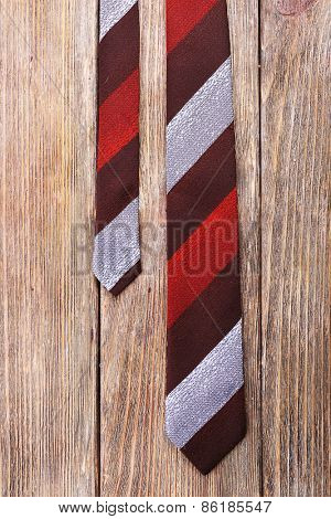 Stripped tie on wooden planks background