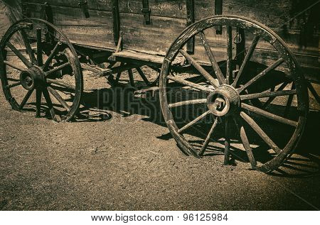 Old wagon wheel symbolic of American Wild West Cowboy concept