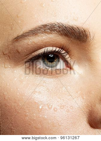 Close-up beautiful eye weth wet skin