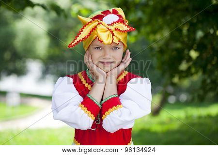 Close up Little girl is dressed in the Russian national dress Ã??Ã?? summer park