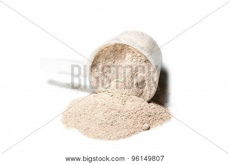 Scoop Of Isolate Protein Powder Chocolate Deluxe Flavour  Poured On White Background