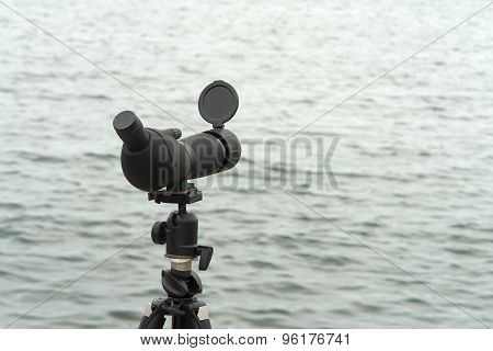 Birdwatching Spotting Scope Monocular On A Tripod Near The Water