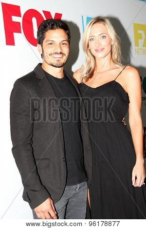 SAN DIEGO, CA - JULY 10: Nicholas Gonzalez and guest arrive at the 20th Century Fox/FX Comic Con party at the Andez hotel on July 10, 2015 in San Diego, CA.