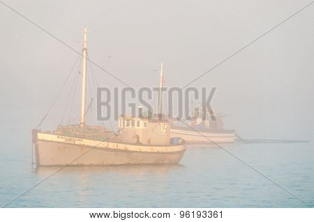 Fishing Boat In Thick Mist