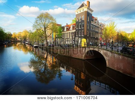 Dutch scenery with canal and mirror reflections, Amstardam, Netherlands, retro toned