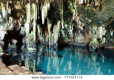 Ancient cenote underground lake in the cave in Yucatan state Mexico