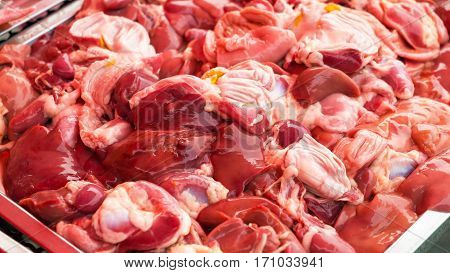 Liver heart and gizzard chicken in the market Chicken entrails in tray Raw food for cooking