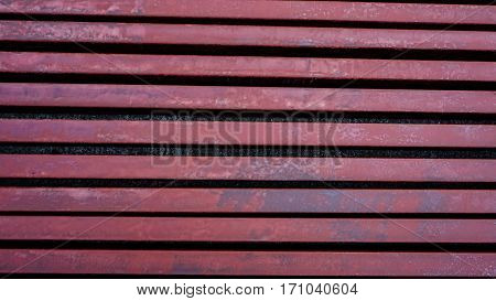 Brown painted steel C-shaped roof and construction tools.