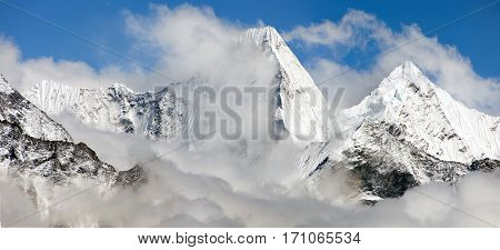 Malangphulang Beautiful panoramic view of himalayas with clouds near mount Ama Dablam on the way to Everest base camp Nepal