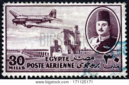 EGYPT - CIRCA 1947: a stamp printed in Egypt shows King Farouk Delta Dam and DC-3 Plane circa 1947