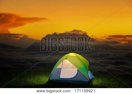Morning sunrise over mist with Huai Nam Dang National Park Chiang Mai Thailand landscape travel and nature Small Camping Tent Illuminated Inside. Night Hours Campsite. Outdoor