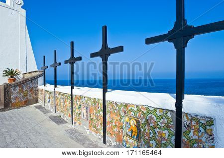 Ischia Italy - October 18 2008:  The cross at the entrance of the Del Soccorso church