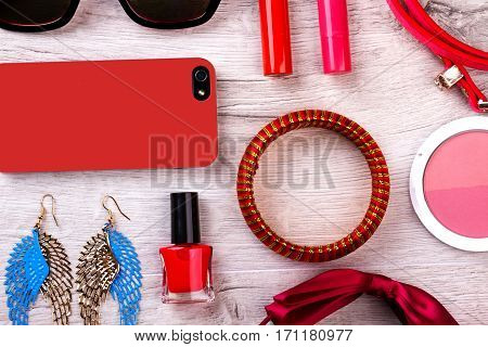 Makeup kit and accessories. Cell phone and sunglasses. Small details for great look. Beauty is style of life.