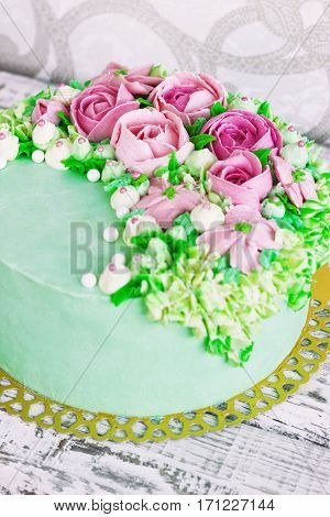 Birthday cake with flowers rose on white background.