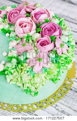Birthday cake with flowers rose on white background.