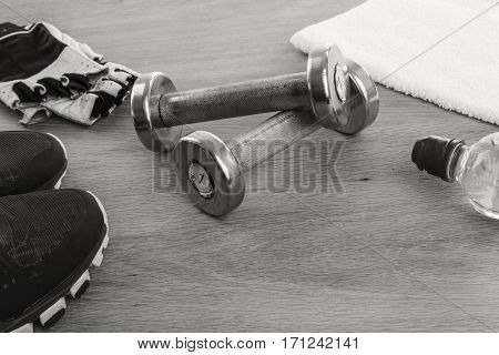 Fitness equipmen on a wooden background. Weight loss and fitness.