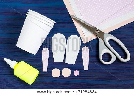 Homemade making of boxes from paper cups for sweets and candy in form of Easter hare. Present children. DIY concept. Step by step photo instructions. Step 2. Cutting details