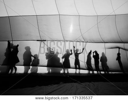 Black and white of Hot air balloon and silhouette of people