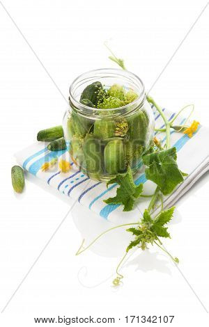 Pickles in glass jar isolated on white.