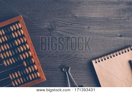 Old Wooden Abacus On Dark Background. The Concept Of Bookkeeping, Business Or Saving Money