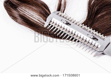 Comb slice hair with blade and hairs on white background.