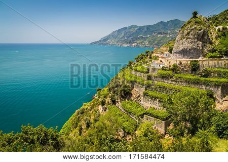 Panoramic picture-postcard view of famous Amalfi Coast with vineyards and Gulf of Salerno on a sunny day with blue sky in summer Campania Italy