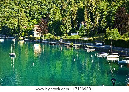 Restful town of Talloires, France, on the lake Annecy. Water sports, calm and peaceful bays and coves, swimming and relaxing.