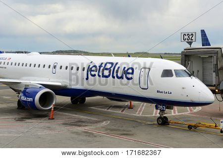 BOSTON - MAY. 6, 2015: Jetblue Airways Embraer 190 taxiing at Boston Logan International Airport, Boston, Massachusetts, USA.