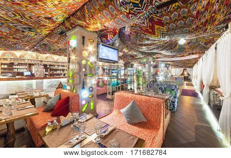 MOSCOW - AUGUST 2014: Interior Chaihana Lounge Eastern restaurant in a traditional style. The main hall with colorful fabric ceiling with ethnic patterns