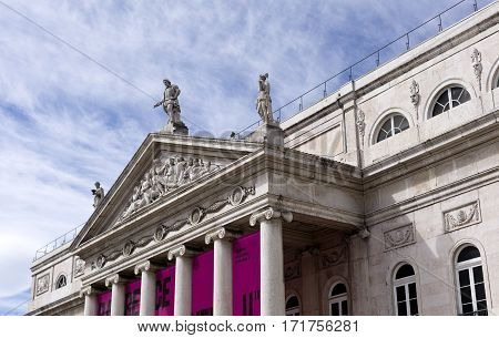 LISBON, PORTUGAL - September 26, 2016: Neoclassical building of National Theatre Dona Maria II (Teatro Nacional Dona Maria II) built around 1840 and located in the Rossio square in Lisbon Portugal.