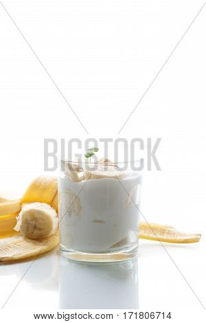 yogurt with bananas on a wtite background