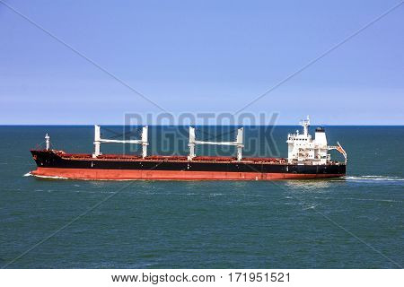 Cargo bulker ship sailing in sea water