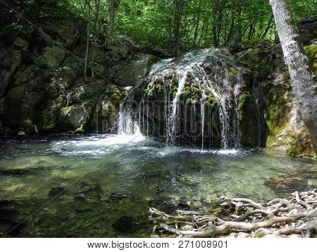 Beautiful Waterfall With Natural Pool In The Mountin Forest. Cascading River On Crimean Mountains At