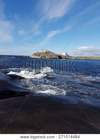 Old Lighthouse By The Sea On Mosteroy Island In Norway