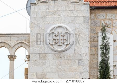Jerusalem, Israel, November 24, 2018 : Holy Cross - A Bas-relief On The Wall Of The Franciscan Monas