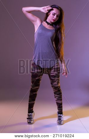 Modern Style Dancer Posing On Studio Background. Hip Hop, Jazz Funk, Dancehall