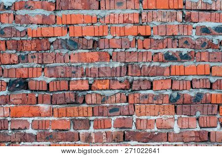 Red Old Worn Brick Wall Texture Background.
