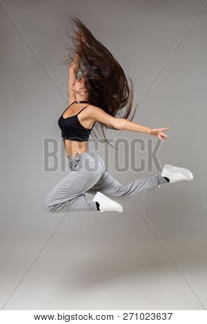Modern Style Dancer Posing On Studio Background. Hip Hop, Jazz Funk, Dancehall