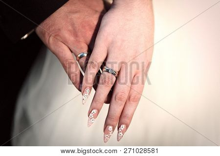 Bride And Groom Holding Hands Close Up