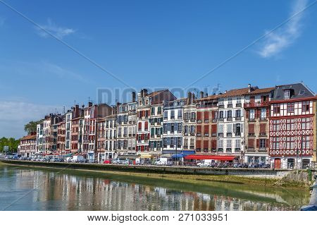 Nive River Embankment With Historical Houses In Bayonne, France