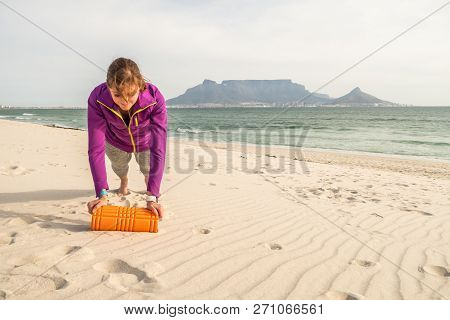 Fitness Model Exercising In Front Of Table Mountain