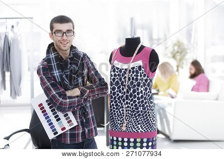 Creative Fashion Designer Standing In His Studio