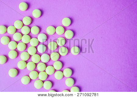Small Yellow Orange Beautiful Medical Pharmaceptic Round Pills, Vitamins, Drugs, Antibiotics On A Pi