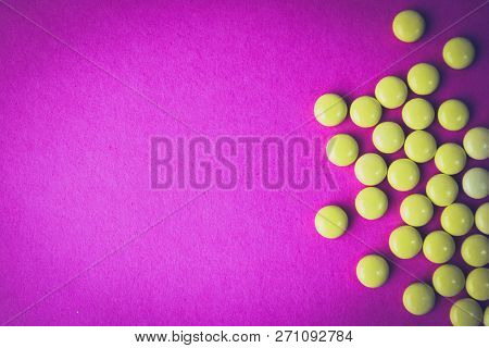 Small Yellow Orange Beautiful Medical Pharmaceptic Round Pills, Vitamins, Drugs, Antibiotics On A Pi