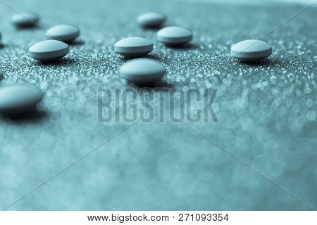 Small Yellow Orange Beautiful Medical Pharmaceptic Round Pills, Vitamins, Drugs, Antibiotics On A Bl