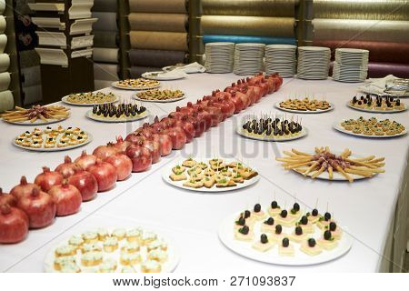 Party Event Buffet Table With Assortment Of Canapes And Pomegran